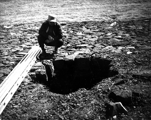 Puzzled man tries to check books out from hole. Wonders what happened to local library.