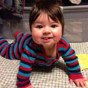 Read more about the article Baby push-ups are hard work, but this girl puts in the effort with a sense of humor.